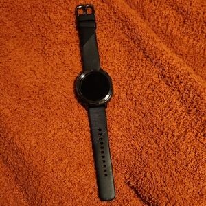Samsung Black Smartwatch with Circular Display and Digital Features
